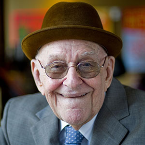 Older man smiling with hat